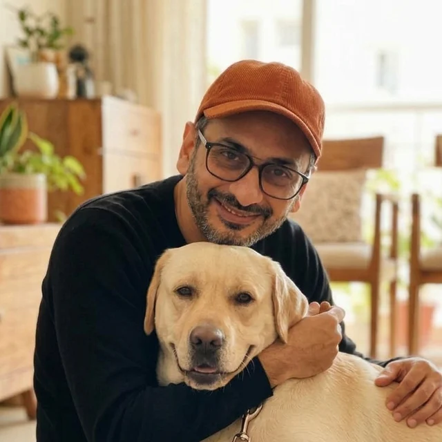 Satyen Aghor hugging his dog, Sky